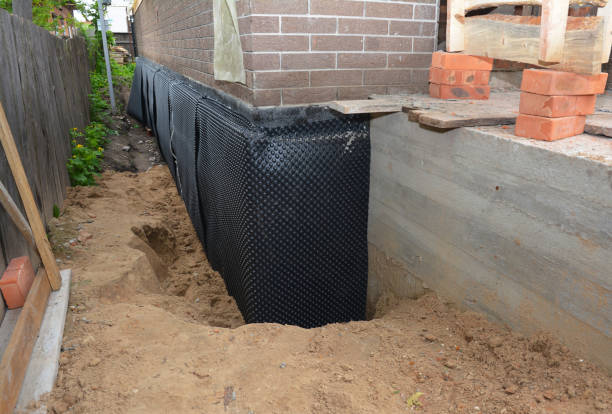 SJ Waterproofing Pros technician performing targeted Exterior Waterproofing assessment in Arpin, WI
